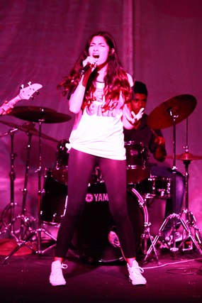 A Year 9 student centre stage at the Band Slam.