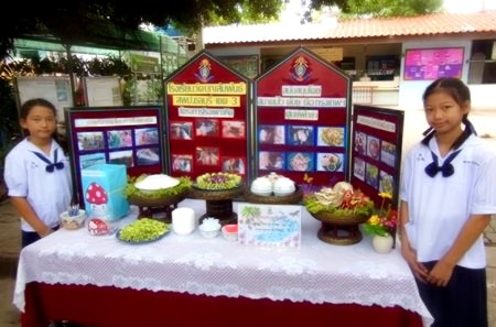 Young women display some of the things that can be made from mushrooms, including mushroom drinks, skin creams and other products with mushrooms as the base ingredient.