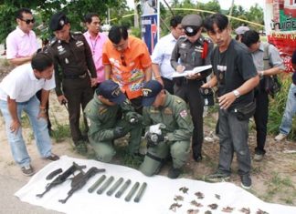 Guns, bombs tossed aside across Eastern Seaboard as NCPO amnesty deadline passes Officials inspect a cache of weapons found in Sattahip.