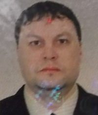 Russian Andrey Atamas has been arrested on an outstanding warrant for his alleged role in a large-scale robbery in Russia by an organized-crime gang.