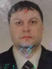 Russian Andrey Atamas has been arrested on an outstanding warrant for his alleged role in a large-scale robbery in Russia by an organized-crime gang.