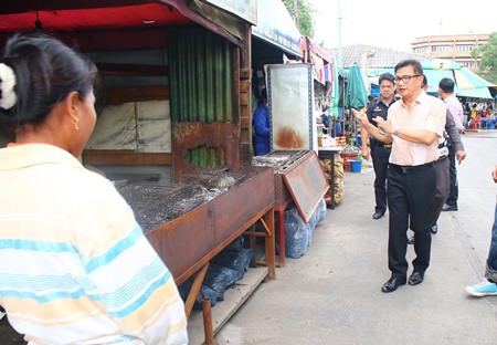 Deputy Mayor Wutisak Rermkitkarn warns vendors that new regulations are coming and tells them to relocate their shops inside.