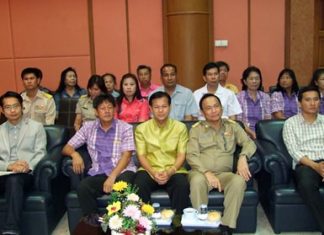 Udomsak Charoenwut, vice president of the Chonburi Provincial Administrative Organization and members of the Chonburi PAO prepare to train “village health volunteers” at Bankao Sub-district offices in Panthong.