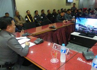 Pol. Col. Supathee Bungkhrong (left) tells traffic police to crack down on parking scofflaws and other law breakers, but do it politely.