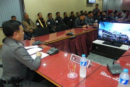 Pol. Col. Supathee Bungkhrong (left) tells traffic police to crack down on parking scofflaws and other law breakers, but do it politely.