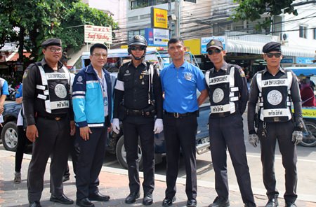 Master Chief Petty Officer Somchai Inruang (right) poses with Pattaya law enforcement.