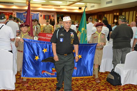 Convention Chairman Al Serrato leads the marching Boy Scouts through the crowd of veterans before the opening ceremony.