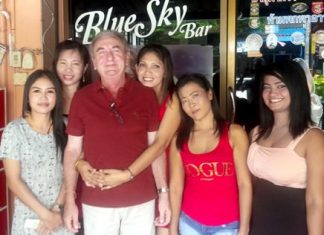 The Bliss (3rd left) celebrates his golfing victory with the staff at Blue Sky Bar.