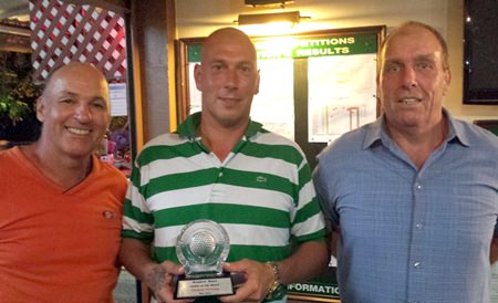 Thomas Nyborg (center) receives the Golfer of the Month trophy for May.