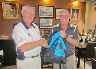 Dick Warberg (left) presents the MBMG Group Golfer of the Month award to Brian Gabe.