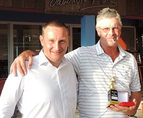 Bob St. Aubin (right) accepts his DeVere trophy and medal from the day’s sponsor, Greg Hirst.