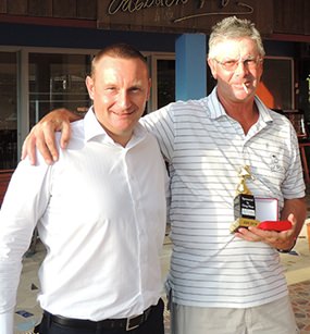 Bob St. Aubin (right) accepts his DeVere trophy and medal from the day’s sponsor, Greg Hirst.