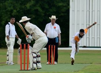 Pattaya Cricket Club’s Hamza (right) bowls against British Club during the first innings of the Plate final.