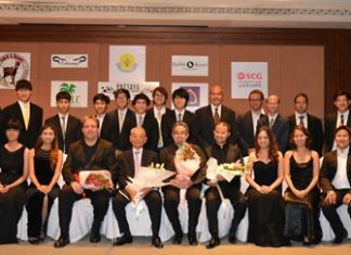 The twenty-four piece Pro Musica Orchestra poses for a group photo.