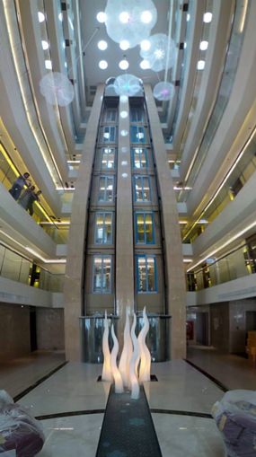 The lobby area of the hotel features marble flooring, crystal chandeliers and furniture from premier Italian designer Casa Fendi.