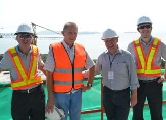 From left: Nigel Cornick, CEO of Kingdom Property; Trever Antony, Development Director, Kingdom Property; Paul Strachan of Pattaya Mail Media Group; and David Johnson, Managing Director of Delivering Asia Communications, pose at the Southpoint construction site.