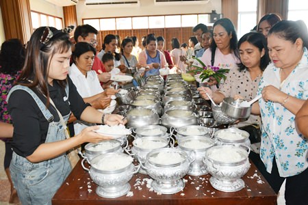 Buddhists make merit on Khao Pansaa, the beginning of Buddhist Lent.