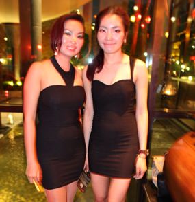 The charming hostesses are always beautifully attired.