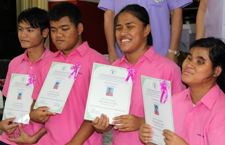The blind students proudly show of their awards.