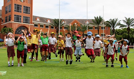Miss Claire and students cheer as the race begins.