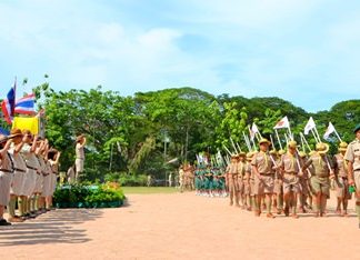 Mayor Itthiphol Kunplome and 116 scouting leaders salute as the Boy & Girls Scours march past.