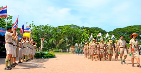 Mayor Itthiphol Kunplome and 116 scouting leaders salute as the Boy & Girls Scours march past.