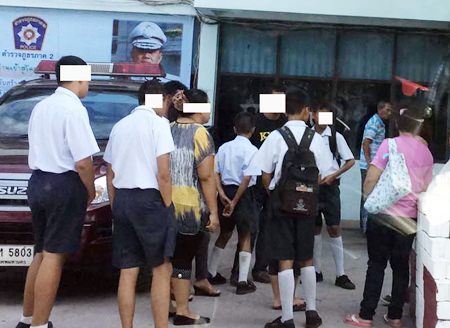 The boys and their parents turn themselves in to Sattahip police to face questioning for attempted rape on their 14-year-old classmate.