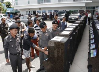 Chonburi provincial police seized 60 slot machines and arrested eight in a raid of a warehouse in Pattaya.