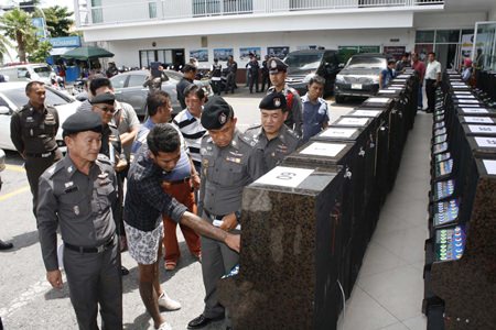 Chonburi provincial police seized 60 slot machines and arrested eight in a raid of a warehouse in Pattaya.