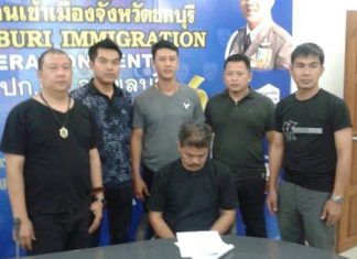 Anucha Sroianusorn (seated) has been arrested and charged with human trafficking.