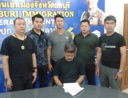 Anucha Sroianusorn (seated) has been arrested and charged with human trafficking.
