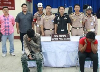 Sattahip military and police officials arrested suspected human-trafficker Nong Pimpmanee (right) and accused loan shark Thanasak Senna (left).