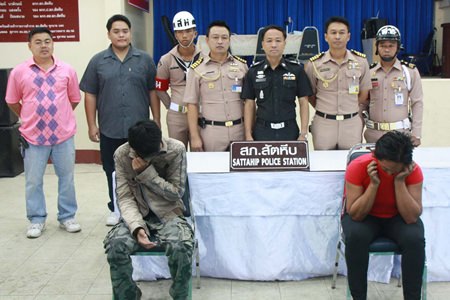 Sattahip military and police officials arrested suspected human-trafficker Nong Pimpmanee (right) and accused loan shark Thanasak Senna (left).
