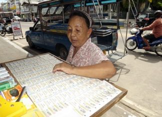 Malinee Saeung chooses her preferred lottery number.