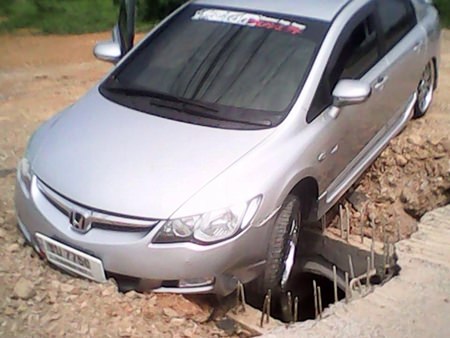 The obstacle course has caused a string of accidents, most recently by Teeranan Opas, who drove his Honda Civic into an unmarked hole, causing damage to the undercarriage.