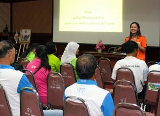 World Vision Foundation of Thailand representative Chalika Haninnee (back right) talks to community leaders about protecting their children.