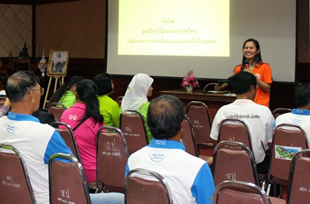 World Vision Foundation of Thailand representative Chalika Haninnee (back right) talks to community leaders about protecting their children.