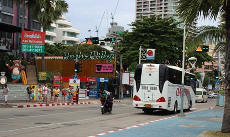An OA Transport bus races down Beach Road.