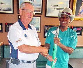 Dick Warberg (left) presents the MBMG Group Golfer of the Month award to Landis Brooks.