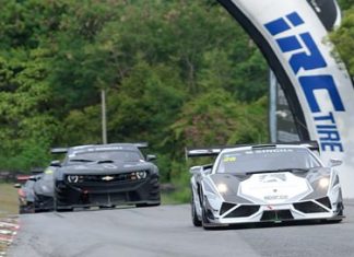 Chonsawat Asavahame (right), in his Lamborghini Gallardo, leads the chasing pack down the back straight in a Super Car Class 1-GT3 race at the Bira International Circuit in Pattaya, Saturday, July 5.