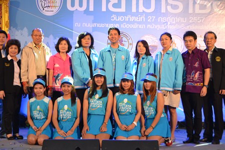 Pattaya mayor Itthiphol Kunplome (standing center) poses with organizers, city officials and sponsors following a July 9 press conference to announce details of this weekend’s King’s Cup Pattaya Marathon.