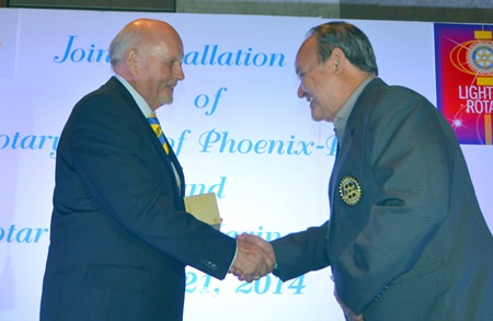 Premprecha Dibbayawan congratulates VP Juergen Schlag (left) who represented President Ingo Raeuber.