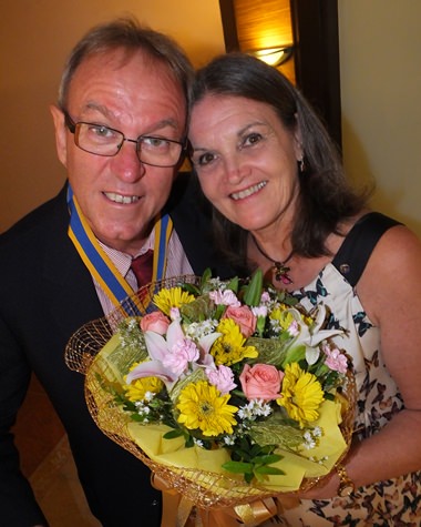 Maggie congratulates her beloved President Russell.