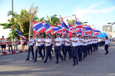 Students from the Asian Maritime Technological College lead the parade down Beach Road.