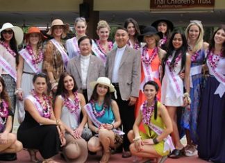 Father Michael and Father Peter, from the Father Ray Foundation, pose with the beauty queens.