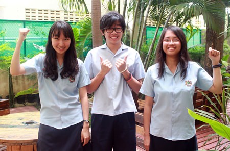 Year 11 star students celebrate (from left) Hui Eun was awarded A* in an amazing seven subjects, Jason did brilliantly well with his IGCSE results and Perfect Pauline gained 9 IGCSEs.