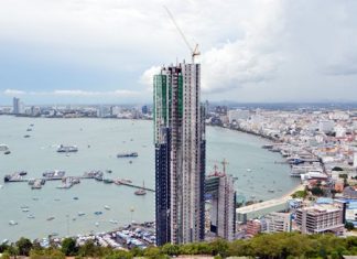 Pattaya halts construction of view-blocking condominium tower Pattaya officials have halted construction of a 53-story condominium and hotel project at Bali Hai Pier that sparked an Internet firestorm after photos showing the tower obstructing a classic Pattaya viewpoint went viral online. Mayor Itthiphol Kunplome stated that the project - first launched in 2004 - has continually followed correct and fully transparent legal processes and he urged anyone alleging that shortcuts were taken to investigate the various hearings and reports themselves.