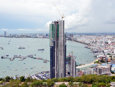 Pattaya officials have halted construction of a 53-story condominium and hotel project at Bali Hai Pier that sparked an Internet firestorm after photos showing the tower obstructing a classic Pattaya viewpoint went viral online.  Mayor Itthiphol Kunplome stated that the project - first launched in 2004 - has continually followed correct and fully transparent legal processes and he urged anyone alleging that shortcuts were taken to investigate the various hearings and reports themselves. 