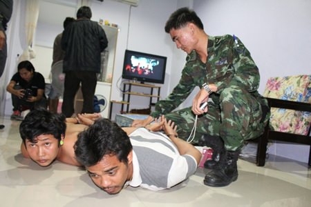 Police and military officials raided another suspected loan shark house in East Pattaya.