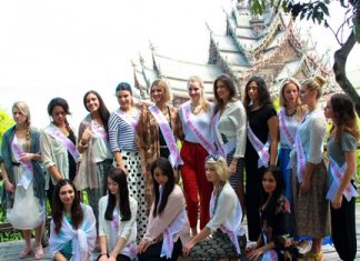 Sixteen of the 25 Miss New Zealand contestants touring Pattaya pose for a photo in front of the Sanctuary of Truth.